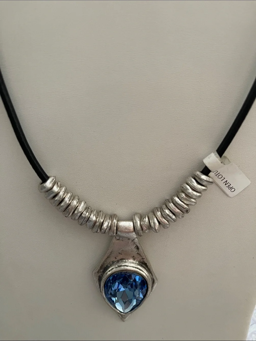 Silver-Plated Necklace with Blue Teardrop Pendant on Black Cord